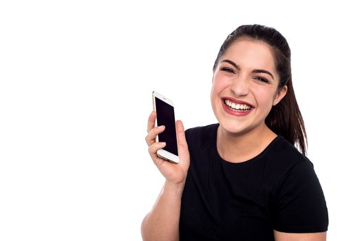 Cheerful woman laughing hard with cell phone