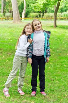 Photo of two playing girls in summer