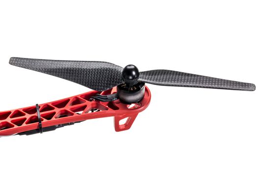 carbon fiber drone propeller, electric motor, and arm with a controller