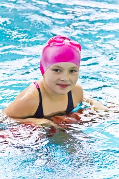 Photo of cute girl in swimming pool