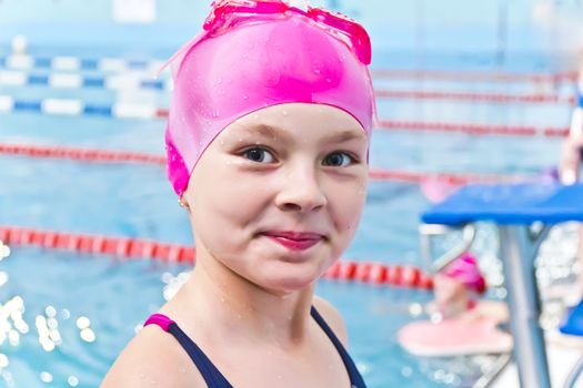 Photo of cute girl in swimming pool