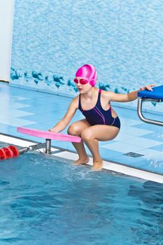 Photo of cute girl in swimming pool