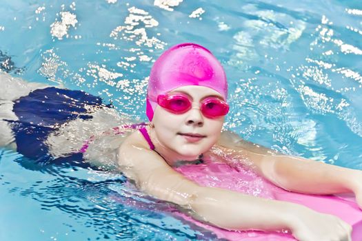 Photo of cute girl in swimming pool
