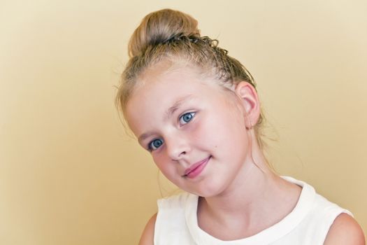 Cute girl with blond long hair and blue eyes