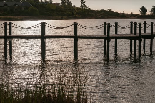 Silhouette of a jetty in a dam near Somerset West in the Western Cape Province of South Africa