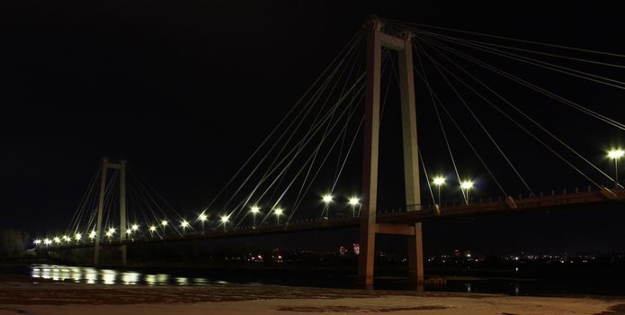 Footbridge over the river at night