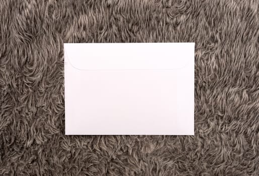 white envelope on a fur background