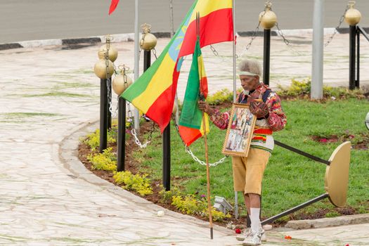 Addis Ababa - May 5: Arbegna, a patriot and war veteran, holds the Ethiopian flag at the 74th anniversary of Patriots' Victory day commemorating the defeat of the invading Italians on May 5, 2015 in Addis Ababa, Ethiopia.