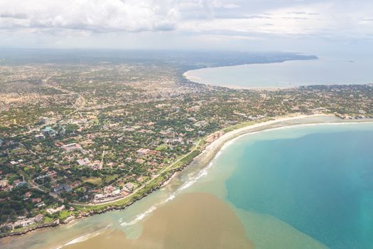 Aerial view of the city of Dar Es Salaam along the shores of the Indian Ocean showing the densely packed buildings