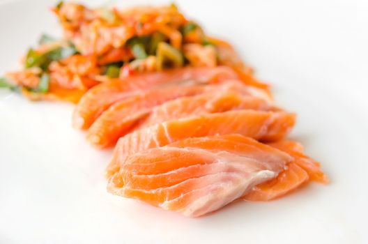close up salmon sashimi with kimchi , asian style cuisine