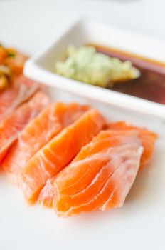 close up salmon sashimi  with wasabi sauce , japanese style cuisine