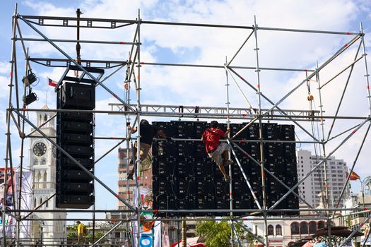 IQUIQUE, CHILE- JANUARY 22, 2015: Unidentified men working on big screen set up for the event called Tunas y Estudiantinas held at the end of January in the city, on January 22, 2015 in Iquique, Chile