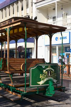 IQUIQUE, CHILE - JANUARY 22, 2015: Old open tram waggon with wooden seats on Plaza Prat main square along Baquedano avenue on January 22, 2015 in Iquique, Chile