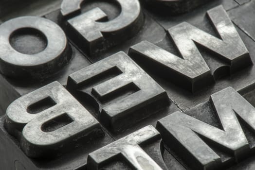 Old lead ink printing type from a book printing company. Historical metal letters from an old printing machine. Created and used in Netherlands in the middle of the last century.
