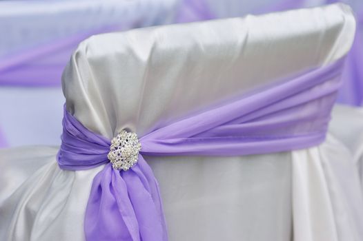 decoration chair purple bow brooch close up