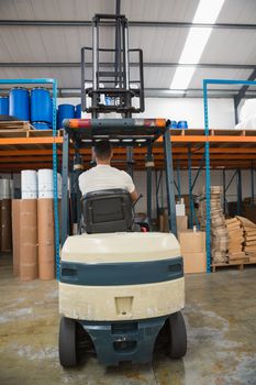 Rear view of forklift machine in warehouse