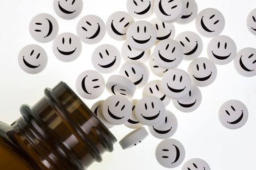 Happy Pills - Drugs used in the treatment of illness pouring from a medicine bottle