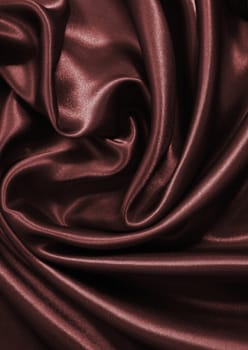 Smooth elegant dark brown chocolate silk can use as background 