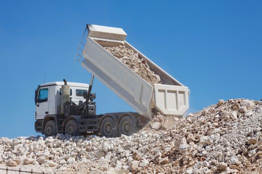 tipper truck unload crushed rocks