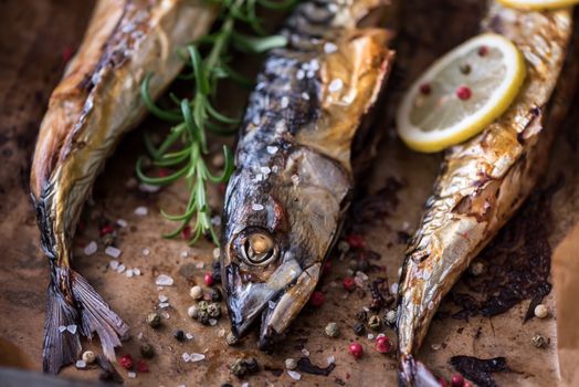 Baked Whole Fish with Spice, Lemon and Rosemary on a Roaster Pan with Baking Paper