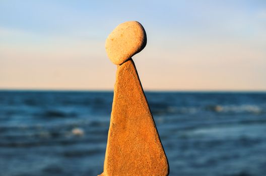 Balancing of stones at the seashore