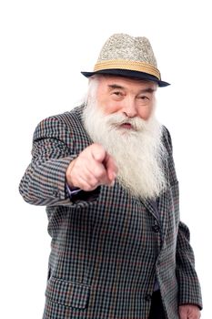 Elderly man pointing his finger to front