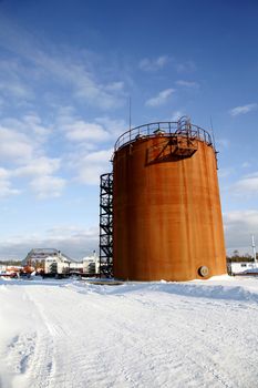 Tank storage crude Oil in winter landscape