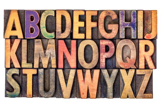 alphabet abstract in vintage letterpress wood type printing blocks, isolated on white