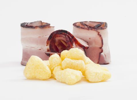 Bacon flowered chips with rolls of smoked bacon