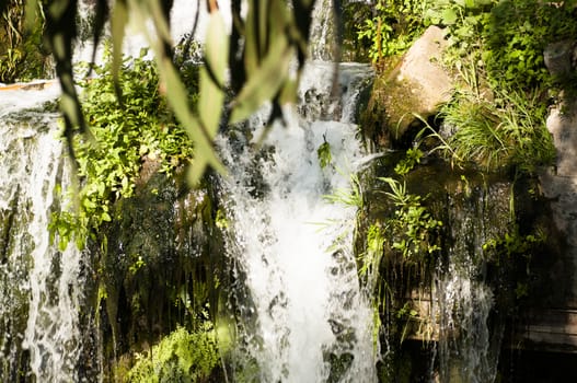 Details of waterfalls in a park in summer