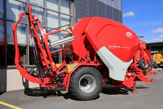 LOIMAA, FINLAND - APRIL 25, 2015: Lely Welger RPC 245 Tornado baler wrapper machine on a yard. The technology incorporated in this machine made it the first genuine variable baler wrapper combination.