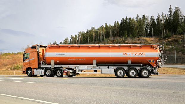 FORSSA, FINLAND - APRIL 25, 2015: Volvo FH semi tanker for bulk transport of RL-Trans on the road. RL-Trans is one of the largest logistics companies in Scandinavia specialized in bulk logistics.