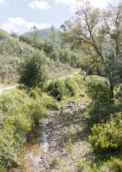 walking trail near small ditch river in the high algarve