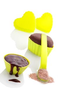 Cupcake chocolate mixture in neon green colored baking forms isolated on white background. Culinary cupcakes baking.