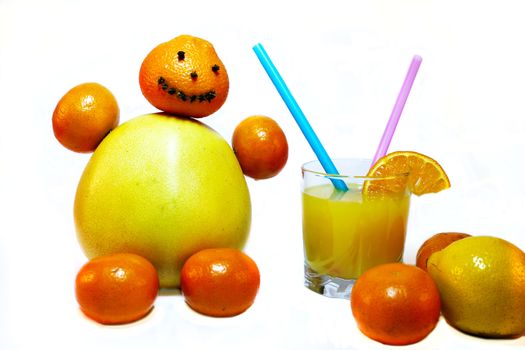 Cheerful man made of pomelo tangerines with a glass of orange juice