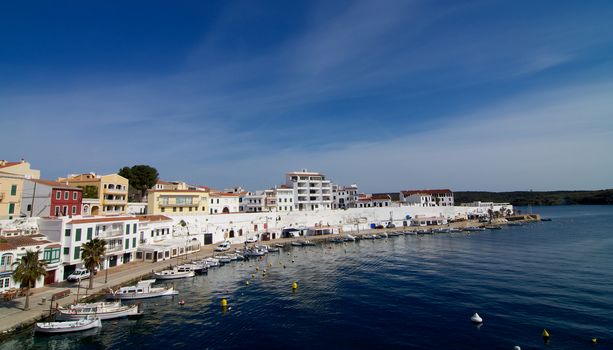 Es Castell Harbor and Lagoon on Blue Skies background, Menorca, Balearic Islands