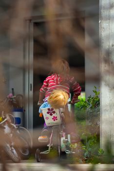 View of Child playing with the bike