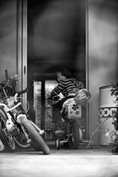 View of Child playing with the bike