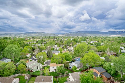 aerial view of resdential area and foothills of Rocky Mountains at springtime - Fort Collins, Colorado