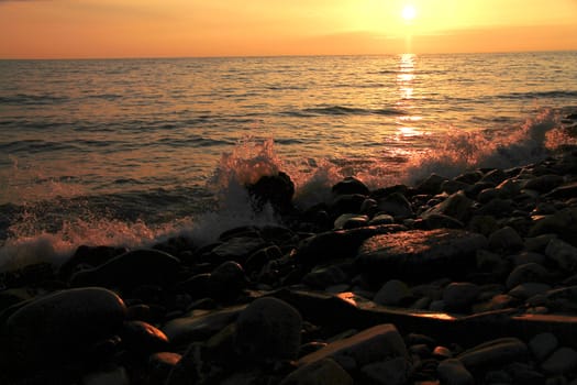 Sunset over the Black sea and summertime beach
