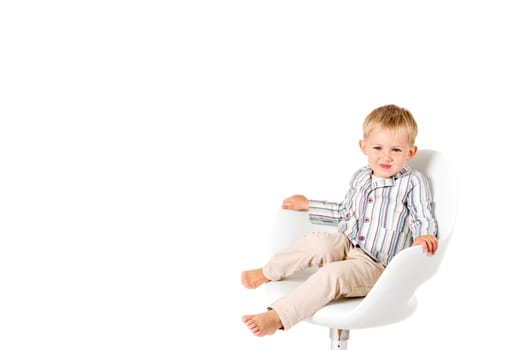 Boy in shirt shot in the studio on a white background