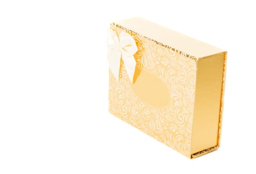 Golden gift box with bow tie isolated on white