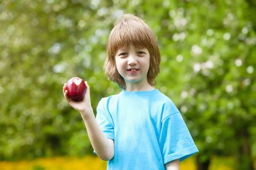 Boy with Red Apple Showing Heart Shaped Bite Off