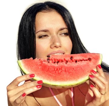 attractive girl eats a slice of ripe water-melon
