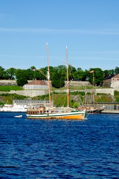 Boat with Akershus Fortress on background, Oslo, Norway