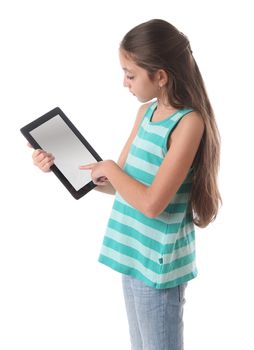 Beautiful pre-teen girl using a tablet computer. Clipping path for the screen