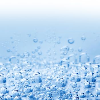 Macro bubbles of water on blue background