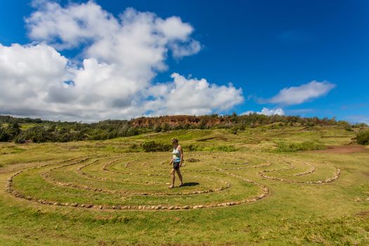 Woman doing walking meditation in labyrinth near Dragon's Teeth