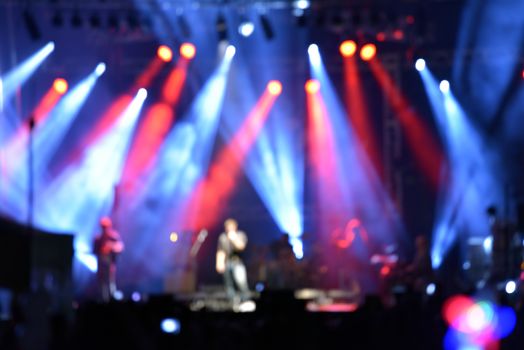 Outdoor rock concert with light background illumination