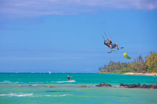 KAHULUI, HI /USA - AUGUST 30: California kite surfer Robert Blum practicing off Kanaha Beach on August 30, 2014 in Kahului, Maui, USA.